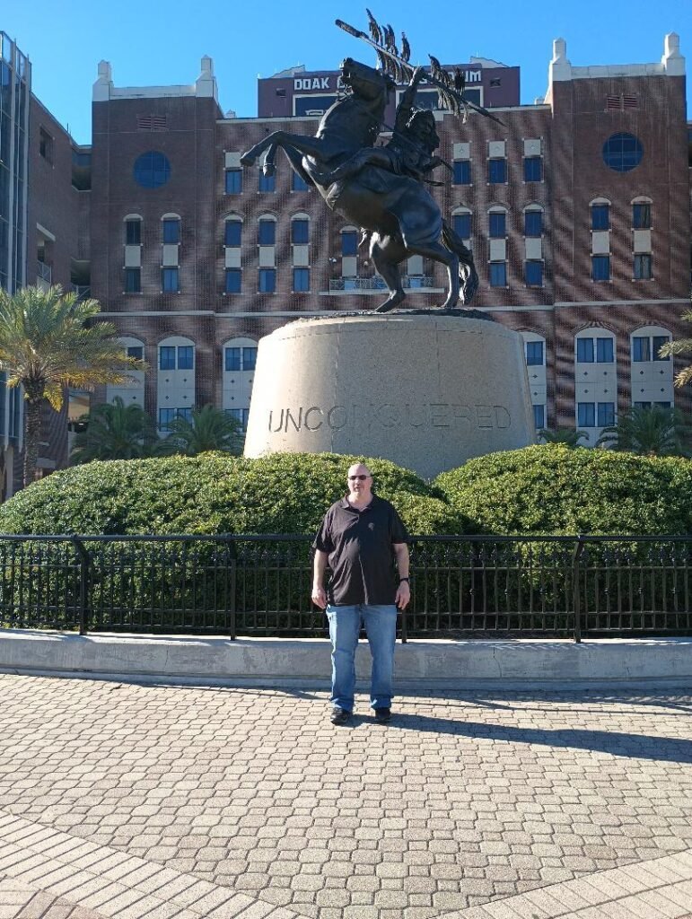 sean van zant image in front of unconquered statue fsu